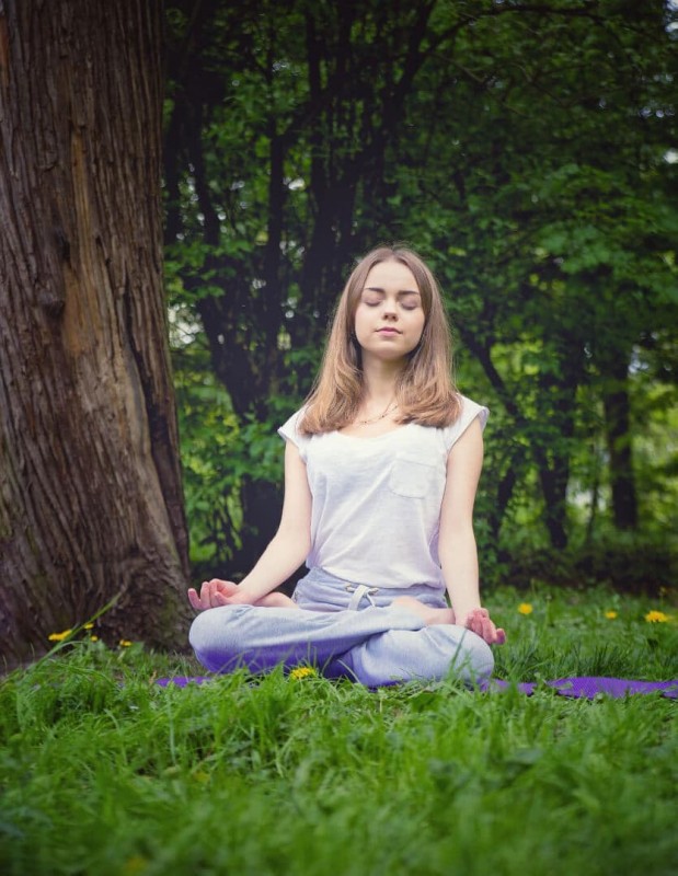 girl-meditating-in-forest-min.jpeg